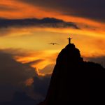 A captivating sunset silhouette of Christ the Redeemer in Rio de Janeiro, Brazil, exuding tranquility and beauty.